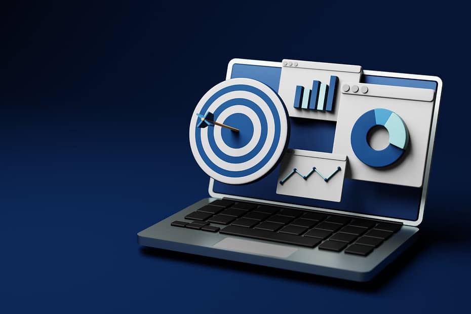 Entrepreneurship Skill Set stylized on dark blue background with target and abstract within a laptop